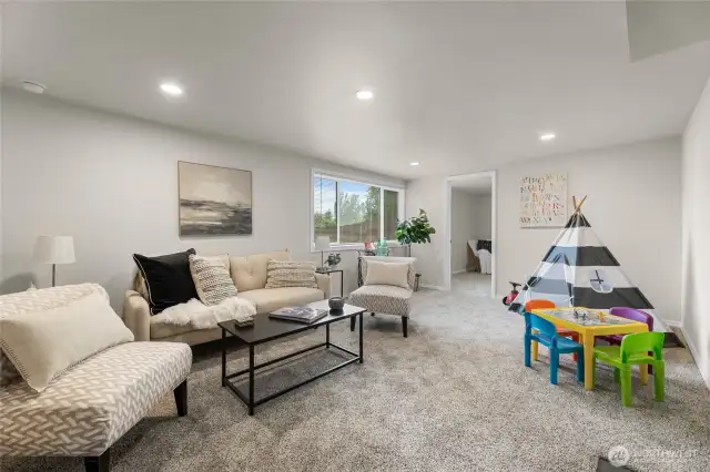 Downstairs living area with new carpet and daylight windows