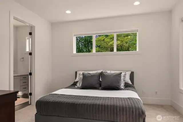 Main floor guest room with attached 3/4 bath