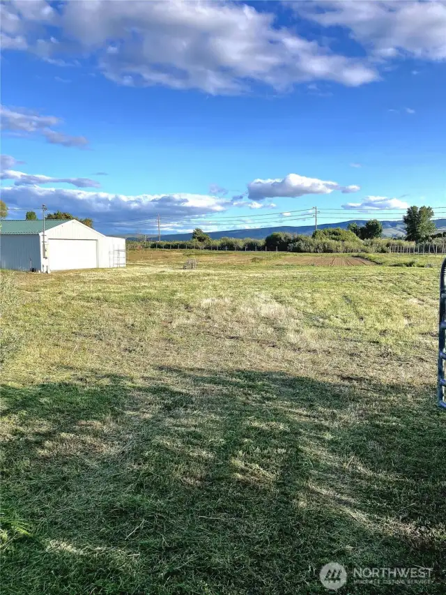 Entering the property with the shop to the left.