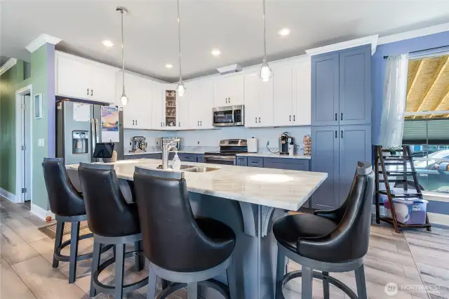 Fully remodeled kitchen with custom cabinets, quartz counters and new appliances.
