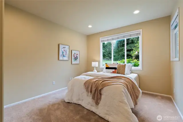 Lower level guest bedroom perfect for multi-generational living!