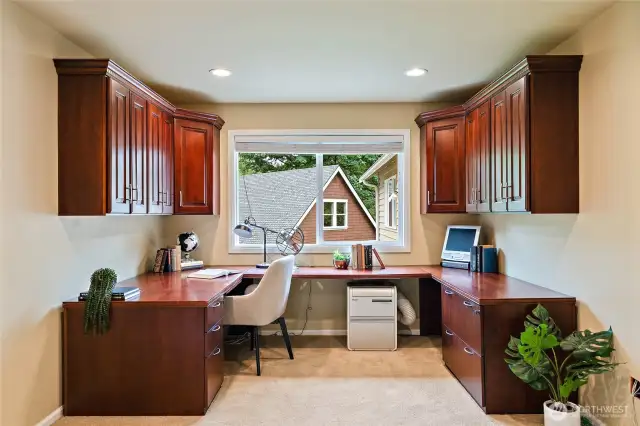 Upper level dedicated office space with large window overlooking the serene back yard.
