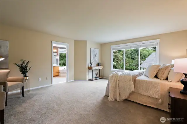 Spacious primary bedroom with plenty of space for a King Bed and sitting area!