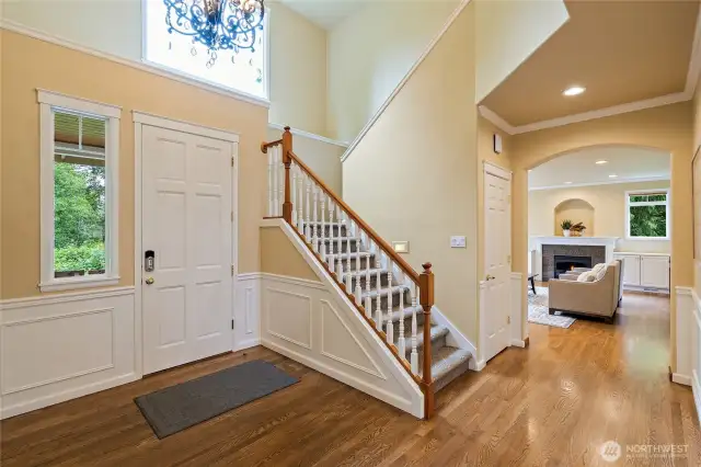 Entry with hardwood floors and vaulted ceilings.