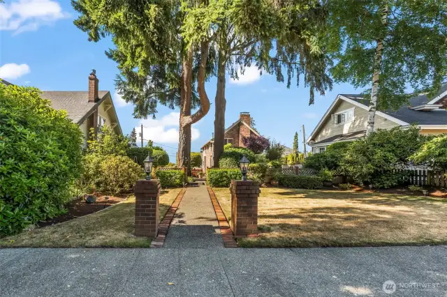 This stately historic brick beauty sits back from sidewalk and street.