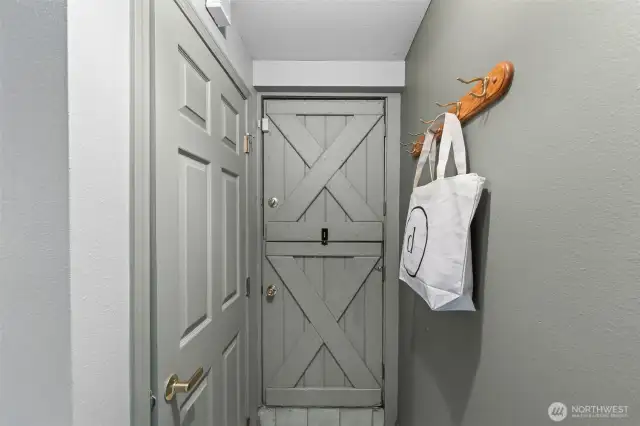 This vintage, completely charming Dutch Door acts as the separate entry off the courtyard to the basement suite!