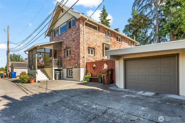 Your carport has an electric garage door and sits off the paved alley.  There is space to park another vehicle back here as well.
