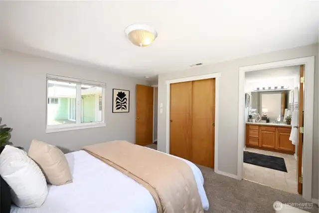 Primary bedroom with plenty of closet space and attached full bath.