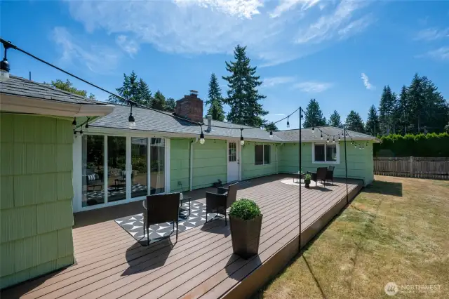 Large Trex deck and a fully fenced backyard with mature landscaping creates perfect spaces for entertaining.