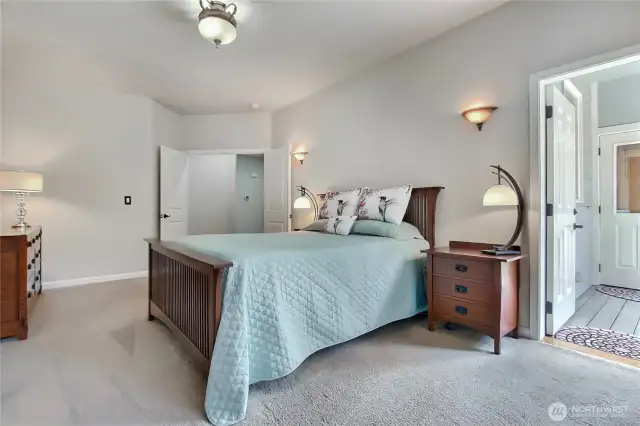 Enjoy comfort and style in the primary suite. Door leads out to private area.