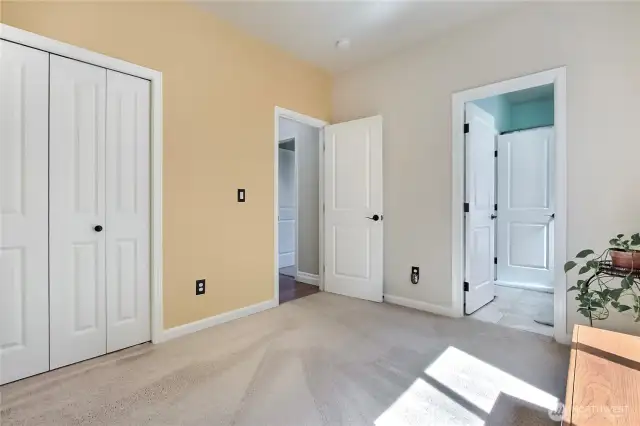 One of two extra bedrooms with a conjoining full bathroom.