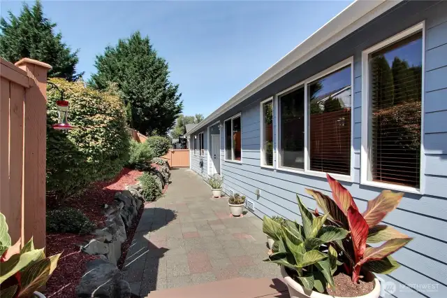 Mature landscaping. Low-maintenance gutter guards. Fresh red mulch, white granite rock, and lava rock landscaping.