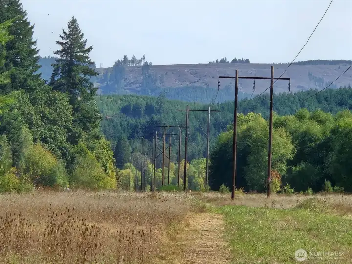follow the poles and lines to the river, land is on your right