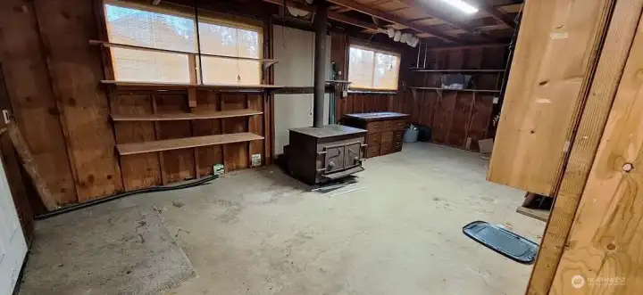 Huge wood stove in garage storage area