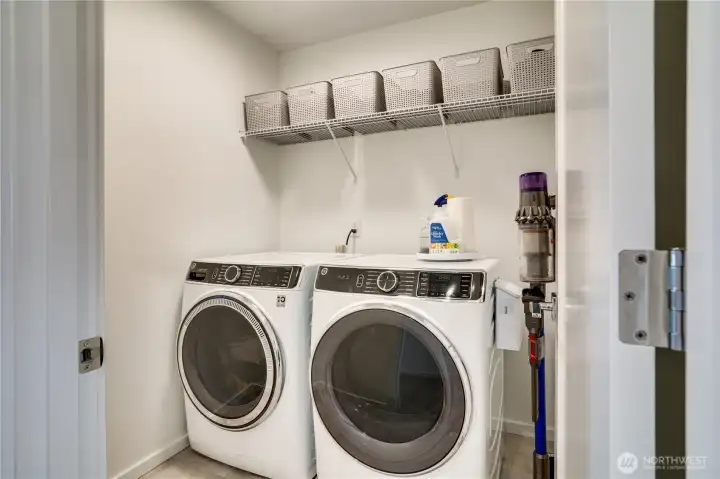 Upstairs laundry room with GE front loading Washer/Dryer.