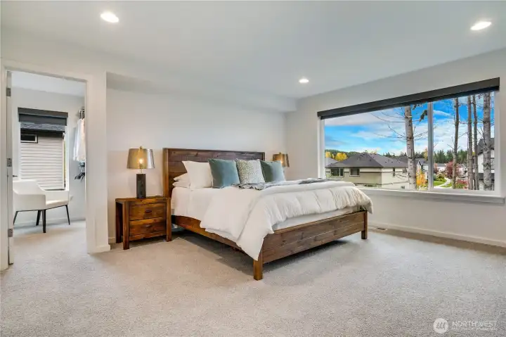 Lush primary retreat-picture windows overlooking the greenbelt, plus upgraded padding under carpet for extra comfort.