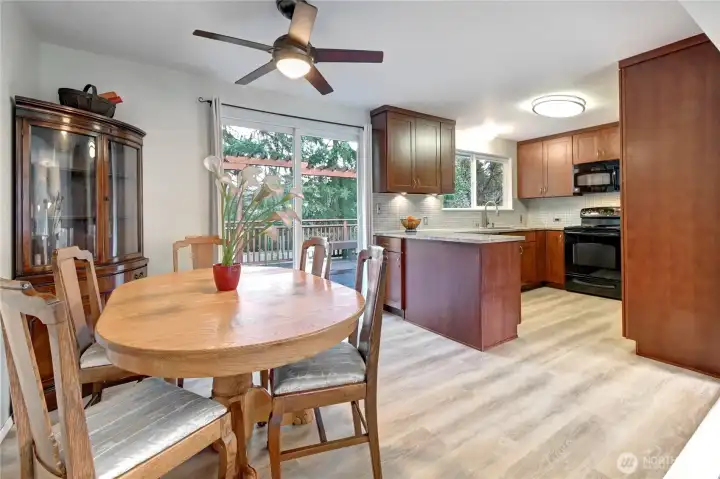 Dining area off Kitchen. One of three sets of sliding glass doors leading to rear deck/yard.