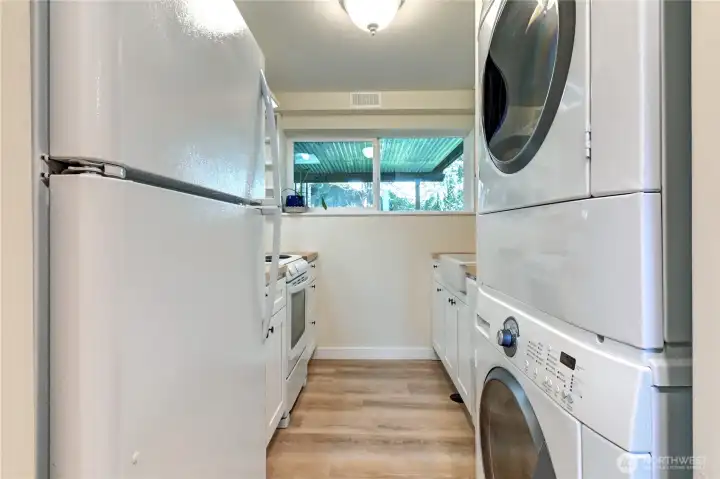 Lower-level galley kitchen w/ new appliances, front end-loading washer/dryer, new flooring & paint.