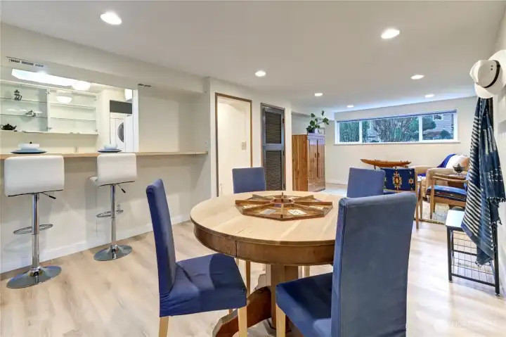 Lower-level ADU breakfast bar off kitchen, dining area + family room area. All new flooring, paint, new hot water heater. Recessed ceiling lighting.