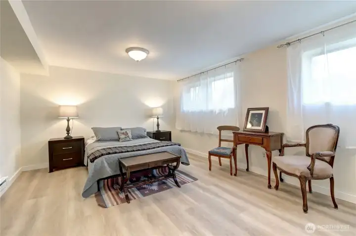 Spacious lower-level primary bedroom w/ new engineered hardwood flooring & paint. 3 bedrooms up. 2 bedrooms down.