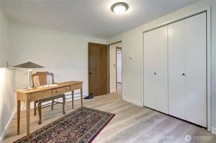 Lower-level bdrm #2. New paint & engineered hardwood flooring.