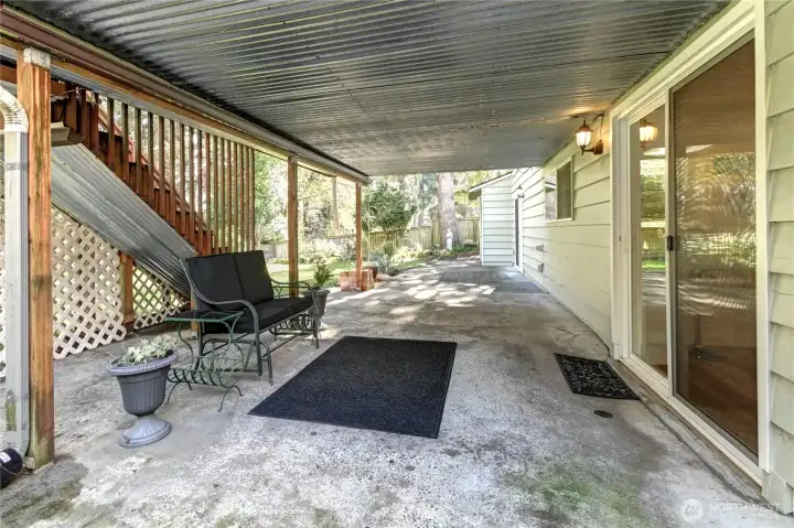 Rear covered patio w/ 2 private entrances for lower-level ADU.