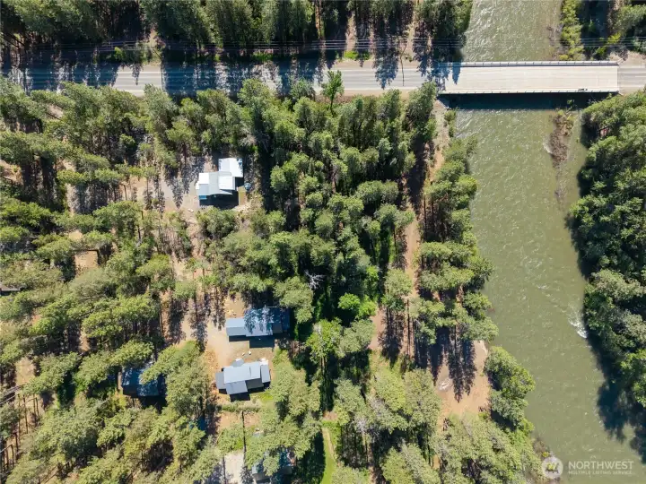 Aerial perspective showing the property, the surrounding homes and the common open space and riverfront