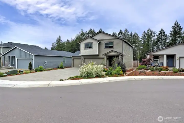 Beautifully maintained, like new home backing up to walking trails and a green belt..