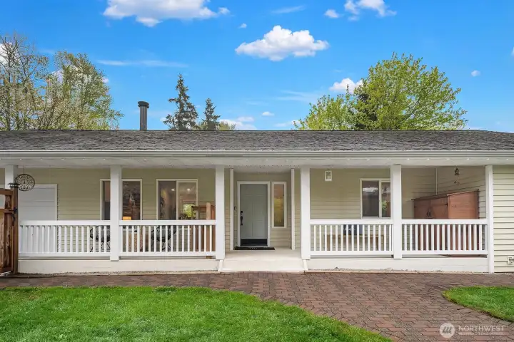 A welcoming covered front porch and classic white exterior set the tone for this turnkey corner lot property, sitting on an expansive .771 acres with incredible versatility, from a private estate to a compelling development opportunity.
