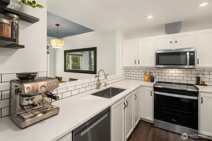 The pass-through to the dining area makes meal prep a joy. The pass-through to the dining area makes meal prep a joy.