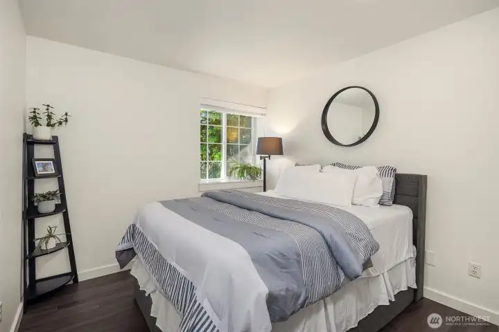 Here is the first of the two secondary bedrooms, both overlooking the front of the home. This is a king-sized bed and there is still plenty of room. Here is the first of the two secondary bedrooms, both overlooking the front of the home. This is a king-sized bed and there is still plenty of room.