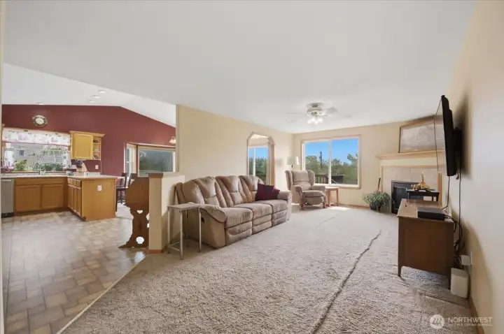 Living space with easy flow to kitchen, dining room, and deck.