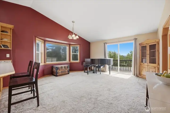 Vaulted ceiling in open concept kitchen and dining room.