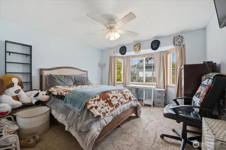 Bedroom with bay window to front yard.