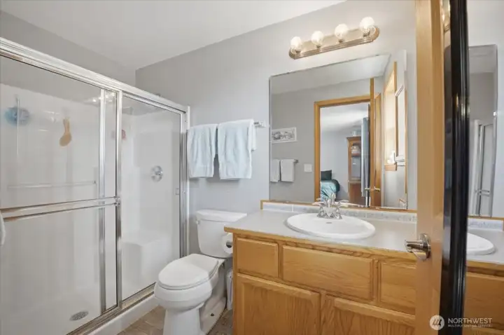 Primary bathroom with oversized step-in shower.