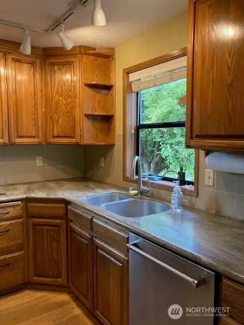 Beautiful counter tops overlooking garden space.