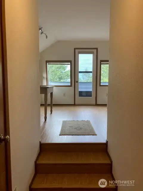 Bedroom with a view, could be used as a studio, office, or anything. Step on to the balcony with a view of the budd inlet.