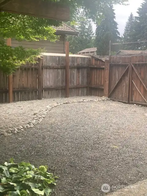 Large space in the back yard, right outside the the garage back door.