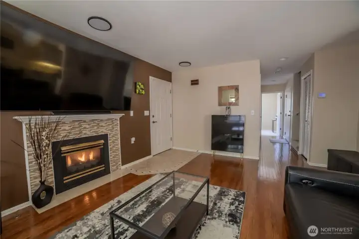 Beautifully maintained 3 bedroom 3 bath Townhome. This is living room with hardwood floors and fireplace . Beautifully maintained 3 bedroom 3 bath Townhome. This is living room with hardwood floors and fireplace .