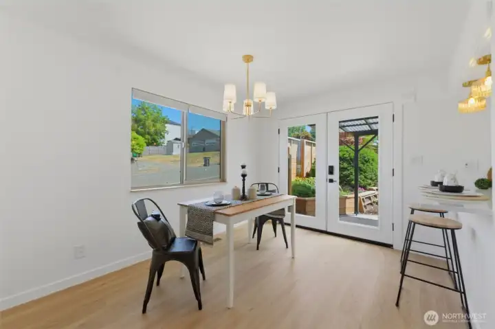 Dining room with French doors leading out to the backyard. Dining room with French doors leading out to the backyard.