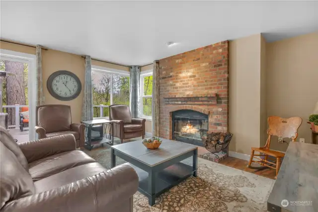 The family room features hardwood floors and wood-burning fireplace for those cool evenings.