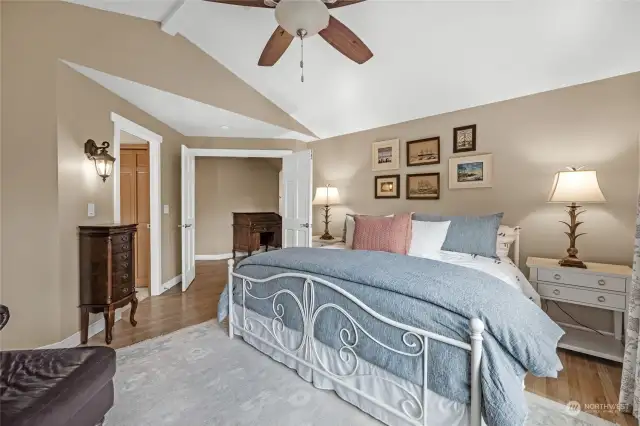The primary bedroom is includes vaulted ceiling, hardwood floors and attached 5-piece bathroom suite.