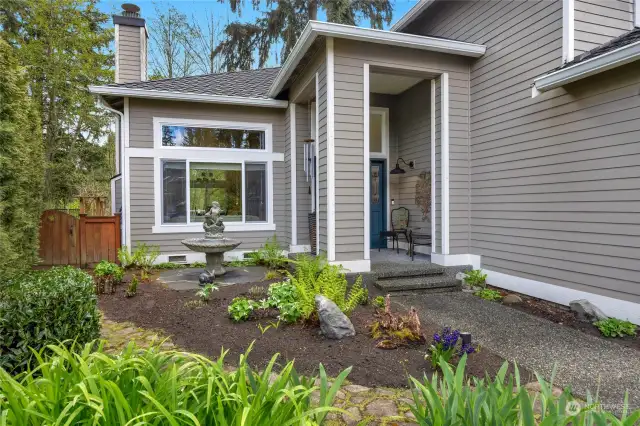 This home is a gardeners dream with plenty of space for your favorite flowers, plants and trees!  The fountain in front of window to go with sellers.