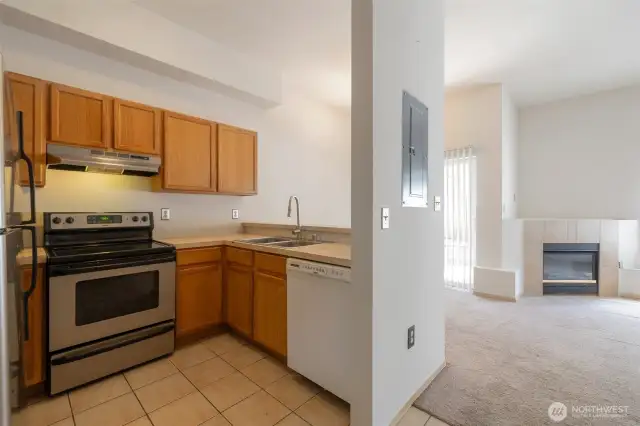 The kitchen opens to a large dining space and cozy living room, perfect for entertaining guests.