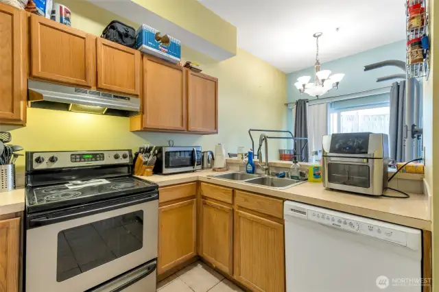 The kitchen opens to a large dining space and cozy living room, perfect for when you have guests!