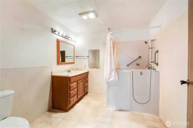 Attached bath to Bedroom #1 with walk in tub