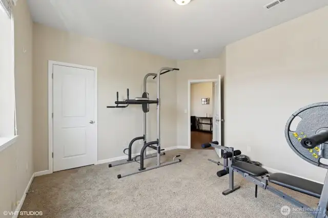 Main floor bedroom w/ Walk-in closet.