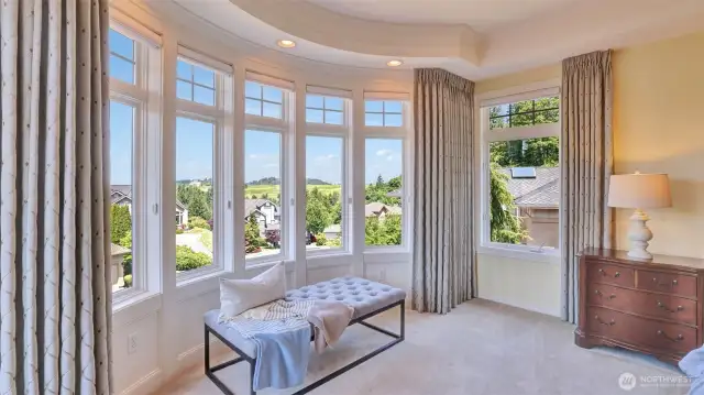 Curved window in sitting space provides architectural style and views of Newcastle Golf Course.