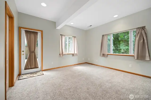 third bedroom located on lower level with outside entrance closet in bedroom is plumbed for half bath/wet bar