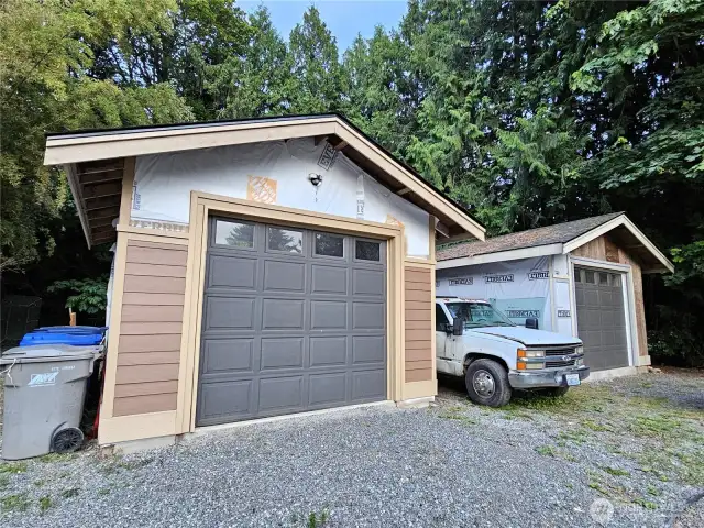Two detached garages offer abundant space for vehicles, hobbies, or future workshops—both currently unfinished, giving you the freedom to customize them to suit your needs and style.